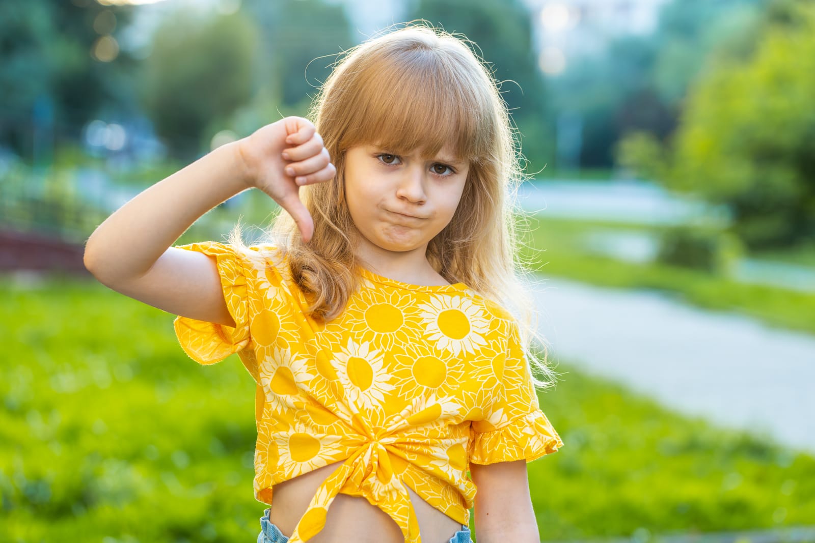 Disappointed girl giving a thumbs-down, symbolizing common mistakes in pediatric board exam preparation and how to avoid them.